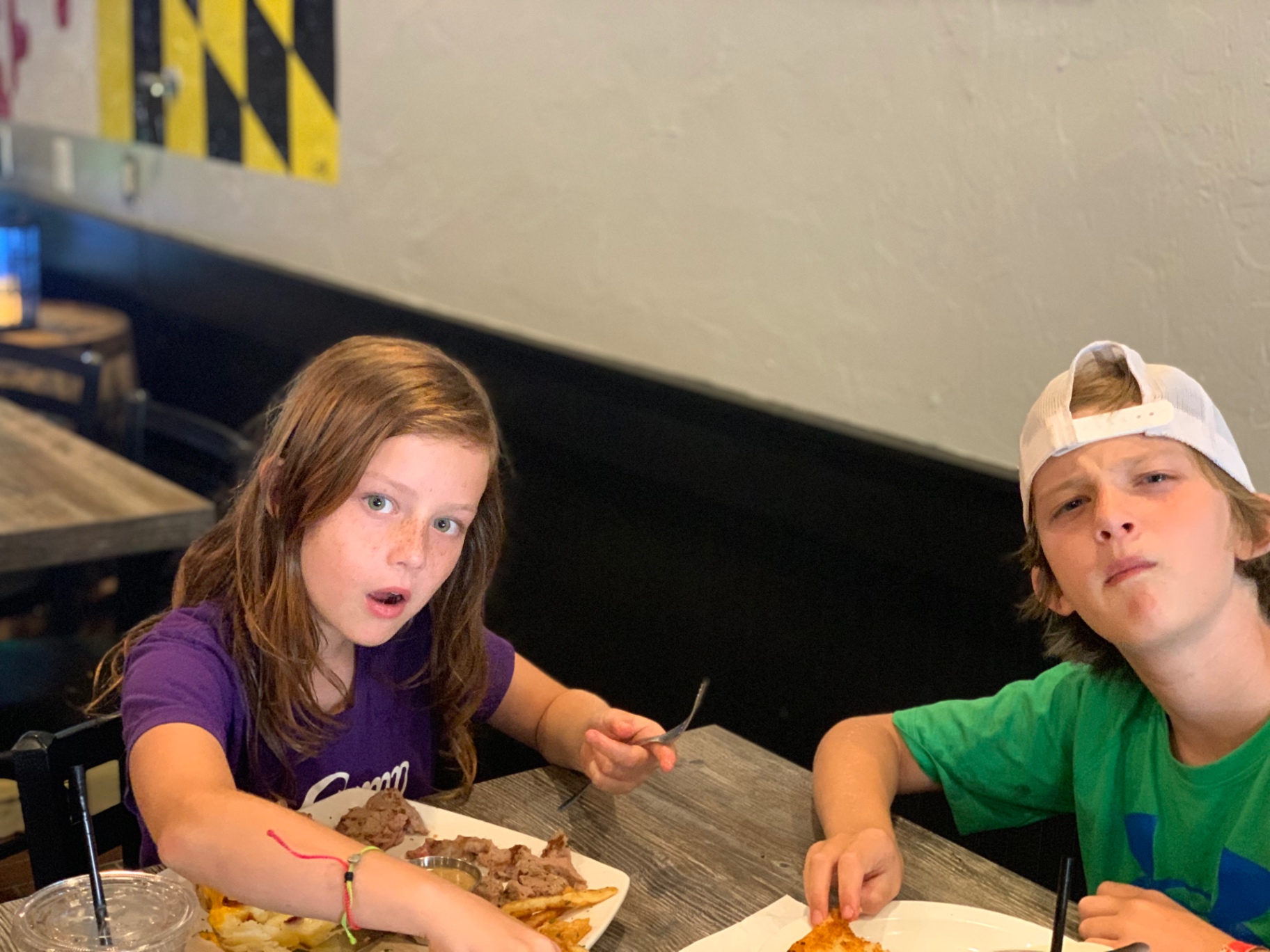 Two children enjoying a meal together